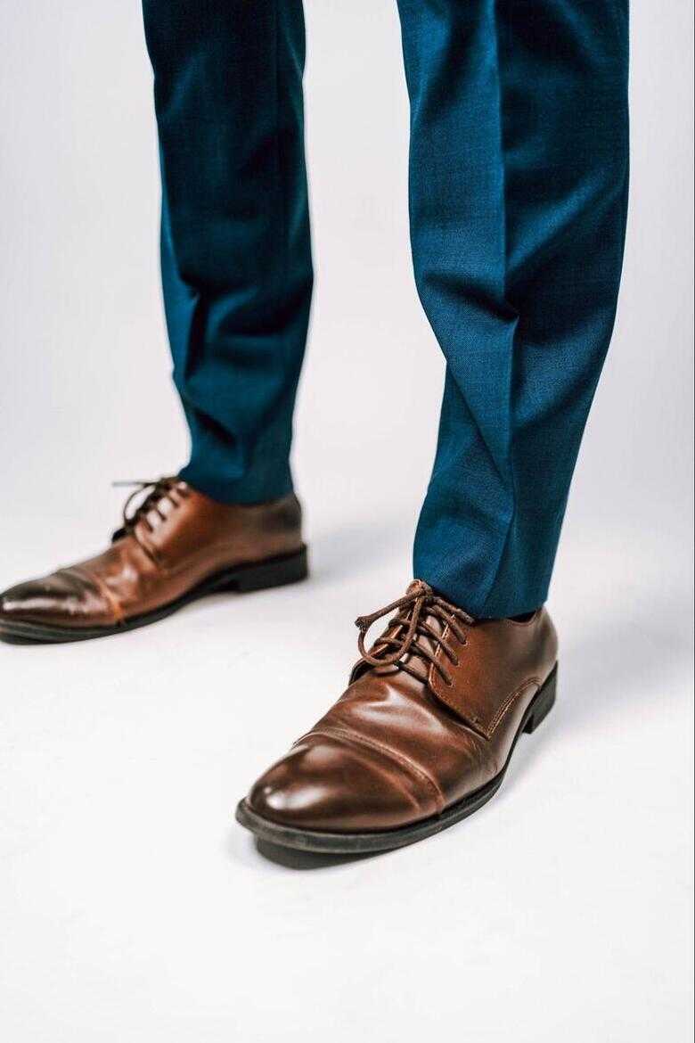 Brown shoes and blue pant